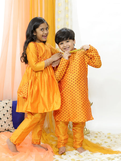 Ethniqndia Orange Silk Blend Ethnic Print Kurta Pyjama Sibling Set